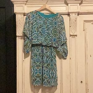 Super flattering boutique style, green and blue dress. Worn once for a wedding.